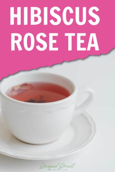 A white tea cup and saucer containing rose tea on a white background. The text says hibiscus rose tea. steeped street the perfect cup.