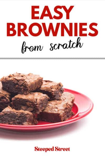 A stack of brownies on a red plate. The text overlay reads easy brownies from scratch. steeped street