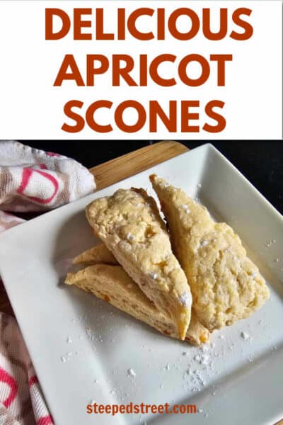 Apricot scone triangles on a white plate. The text overlay reads delicious apricot scones. steepedstreet.com