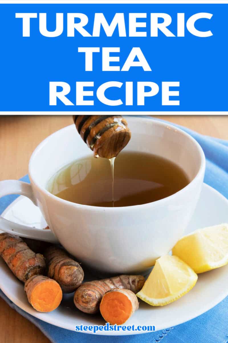 Turmeric tea in a white cup an saucer on a blue cloth surrounded by lemon and turmeric root. The text reads turmeric tea recipe. steepedstreet.com