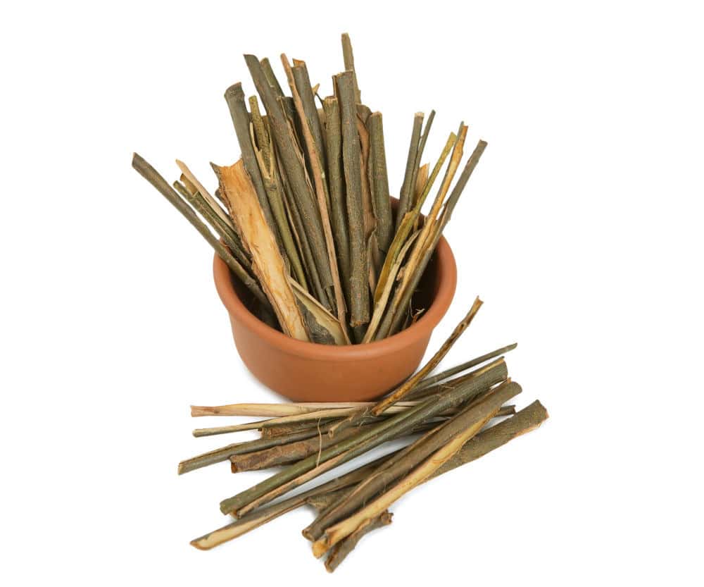 Dried willow bark in a terracotta pot.