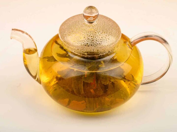 Willow bark tea in a glass teapot.