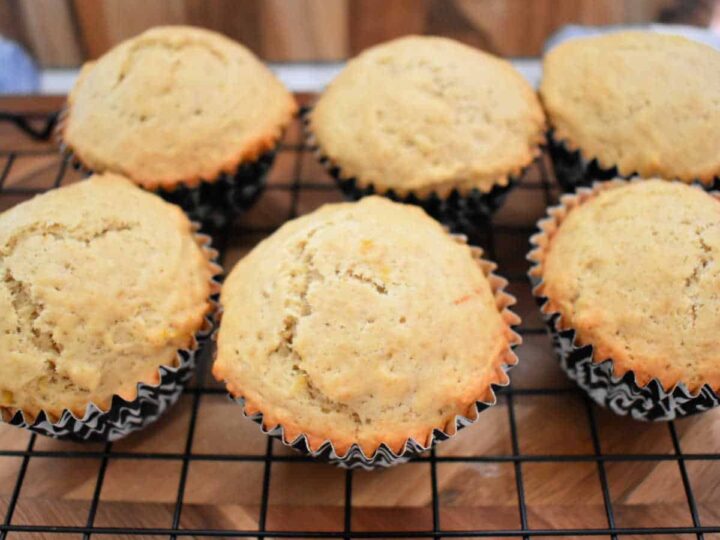Earl Grey muffins on a cooling rack.