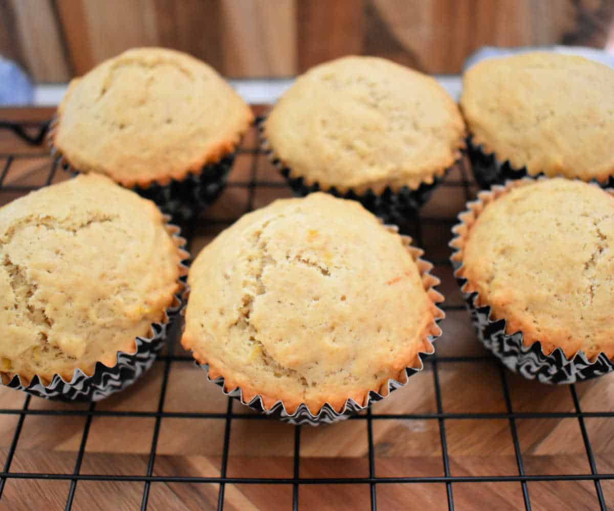 Earl Grey muffins on a cooling rack.