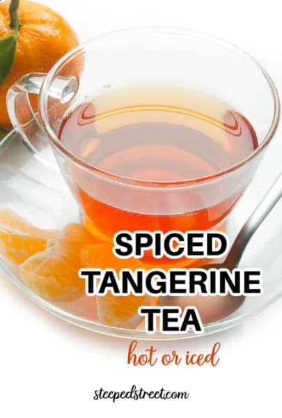 Tangerine tea in a glass cup with a fresh tangerine and tangerine sections. The text reads how to make spiced tangerine tea. hot or iced.