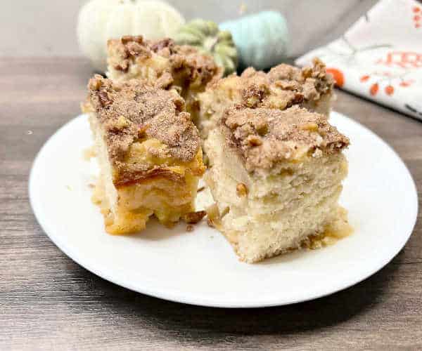 Peach tea cake on a white plate.