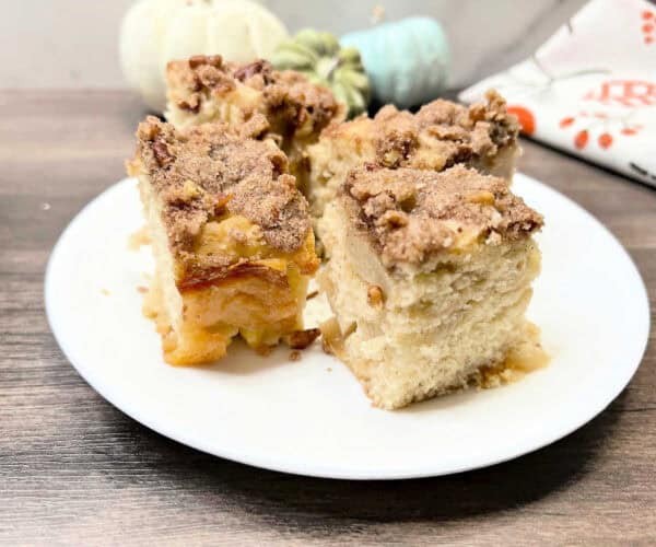 Peach tea cake on a white plate.