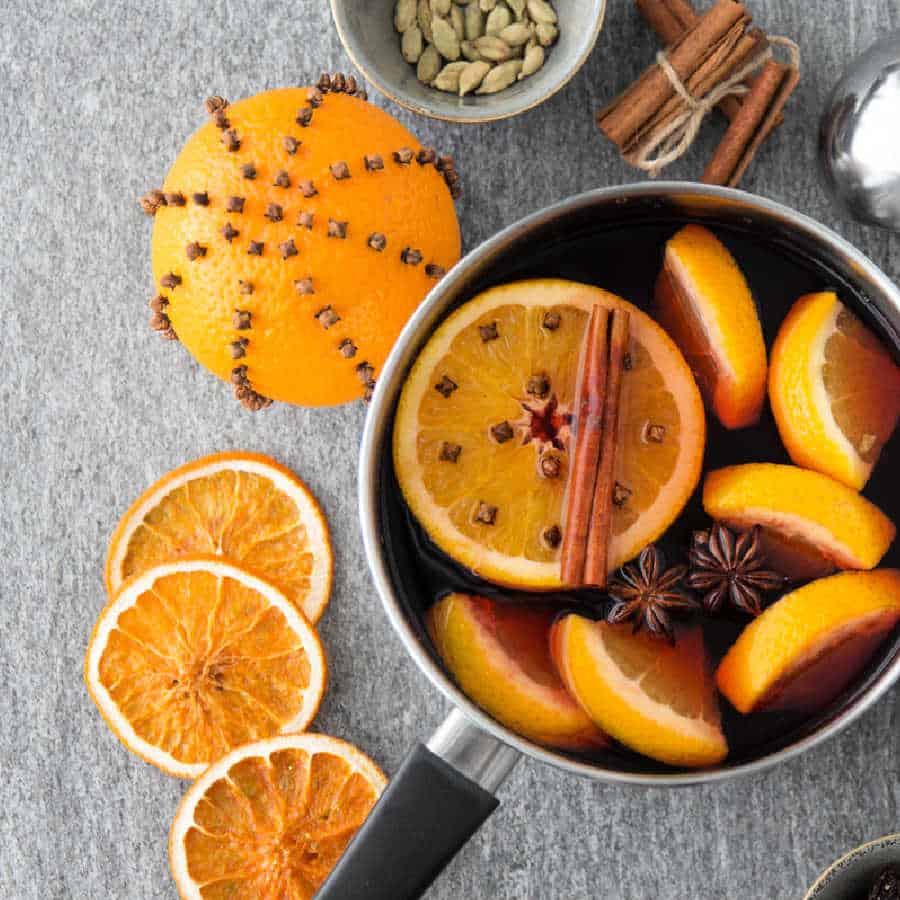 Cinnamon, cloves, and orange slices in a simmer pot.