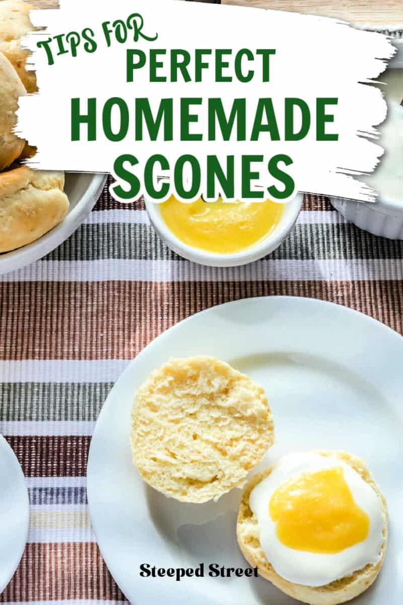 A scone on a plate with cream and lemon curd and a bowl of lemon curd. The text reads tips for perfect homemade scones.