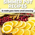 Citrus slices, cranberries, cinnamon sticks, and star anise on a wooden table. The text reads 5 fall simmer pot recipes to make your home smell amazing.